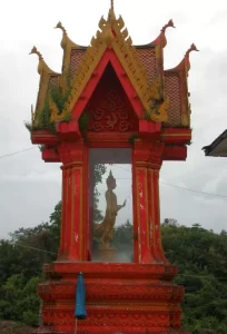 Standing Buddha Inside Red Temple in Thailand