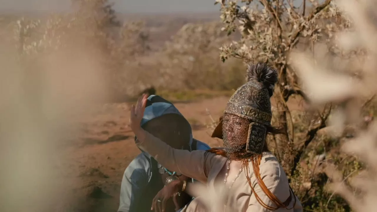 still from transmission music video with amyra mah