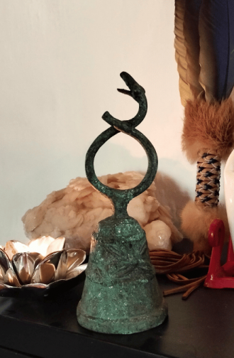 serpent antique bronze bell, symbolising rising in consciousness amids Epstein files, by Amyra Mah