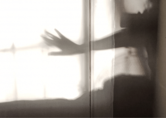 shadow shot of outstretched arm, for article about whether spirituality can bring real changes by amyra mah